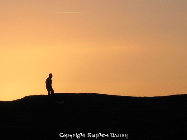 A warm sky over Burton Dassett Hills on a cold winters' day