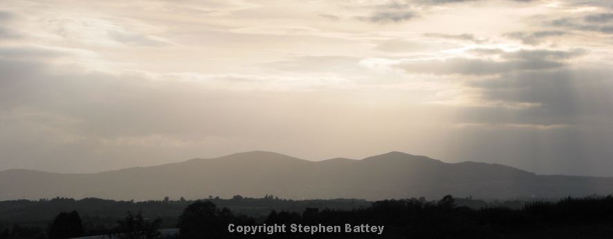 Sun shine through the haze over the Malverns