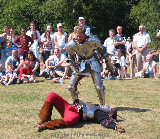 Knights in armour battle with swords